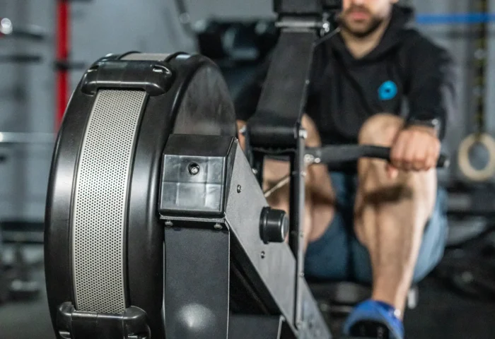 a man using the RPM Power air rowing machine