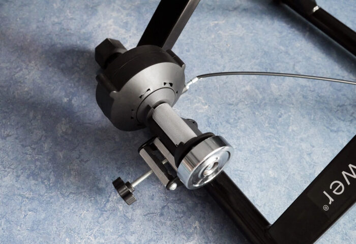 close up of RPM Power cycle trainer against a blue background